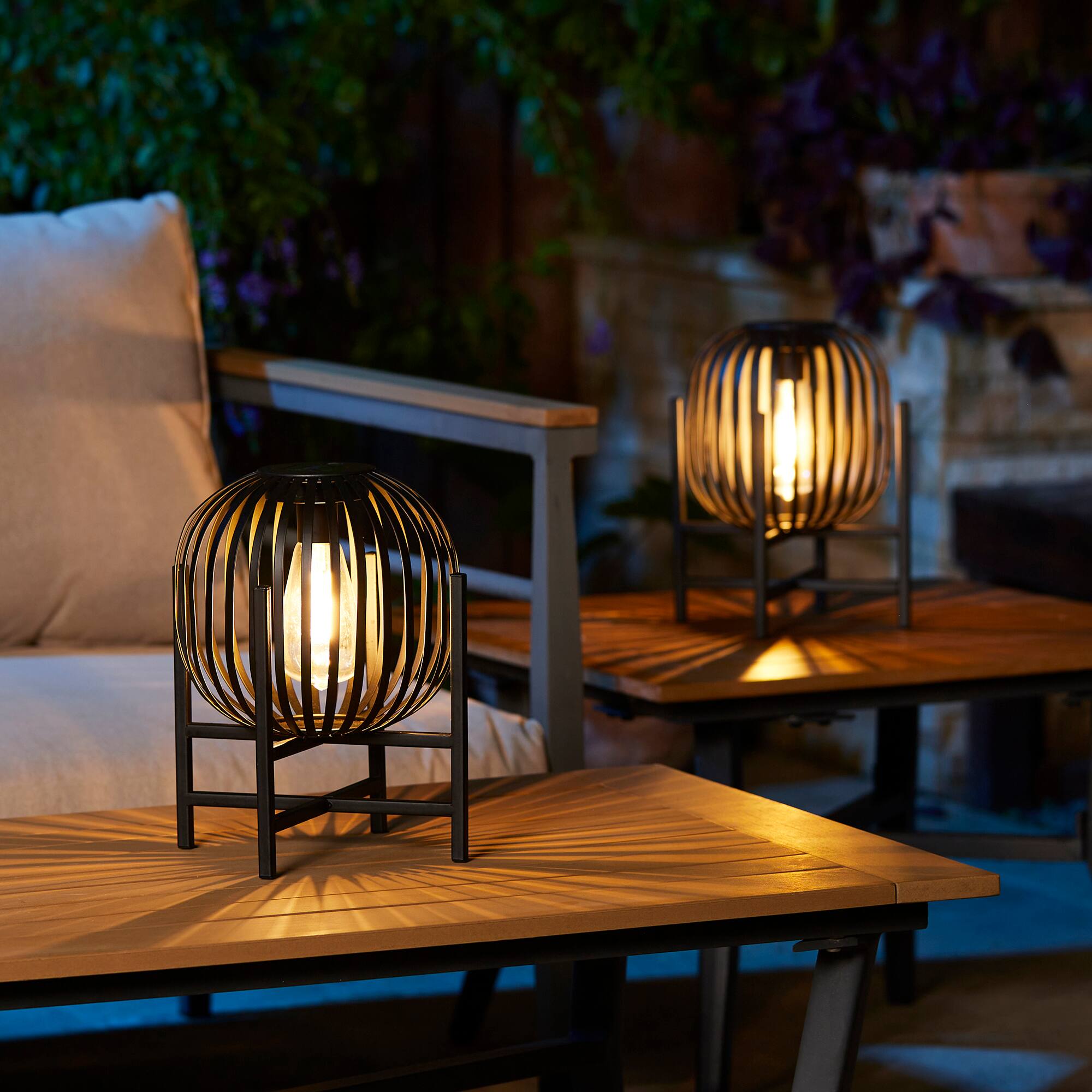 Glitzhome® 11.5" Black Slim Metal Stripes Solar Powered Edison Bulb Outdoor Lantern, 2ct.